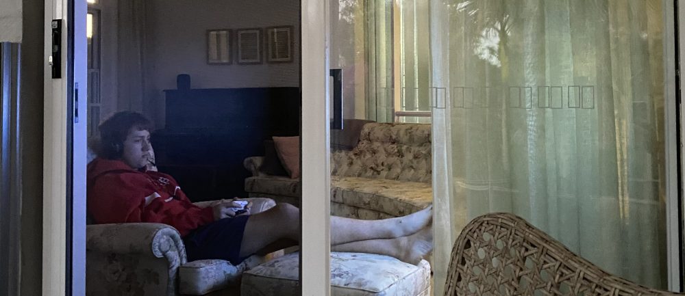 Teen behind sliding security door