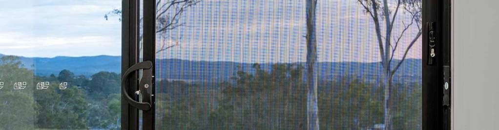 View of a rural landscape at sunset through a ForceField screen