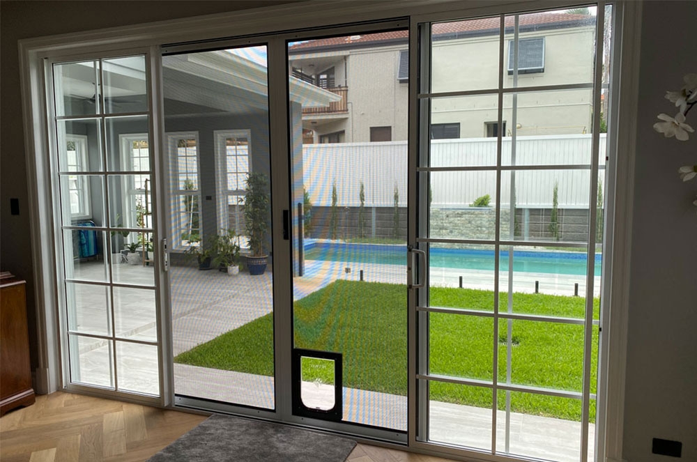 ForceField sliding door with pet flap